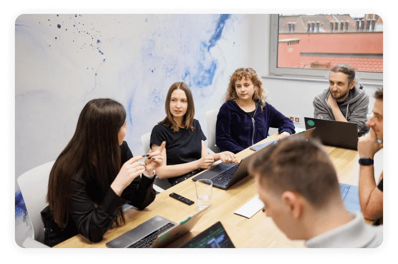 A photo showing people in a meeting